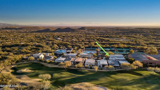 aerial view at dusk featuring a mountain view