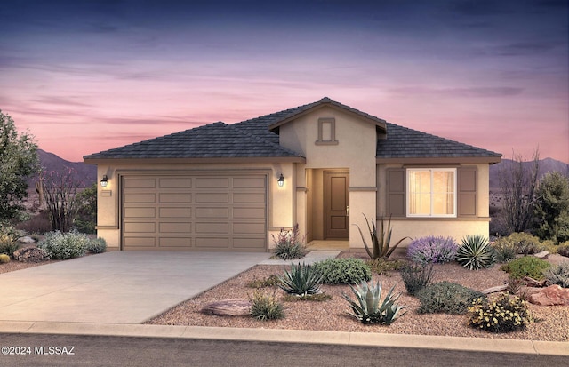 view of front of house featuring a mountain view and a garage