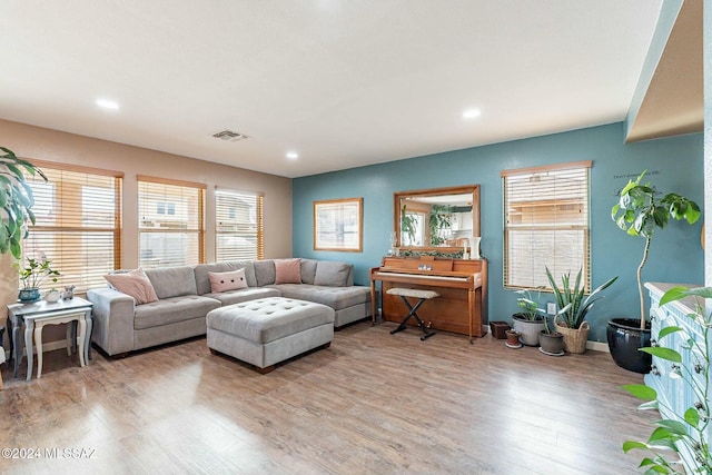 living room with light hardwood / wood-style flooring