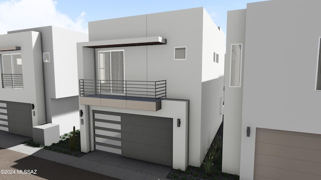 contemporary home featuring a balcony and a garage