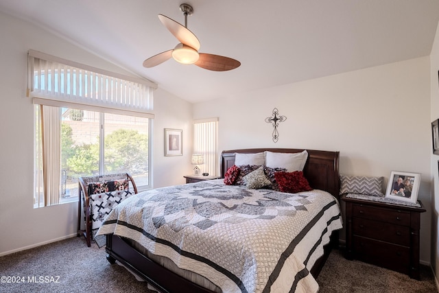 bedroom featuring ceiling fan, vaulted ceiling, and dark colored carpet