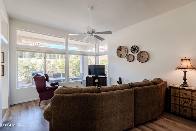 living room with wood-type flooring and ceiling fan