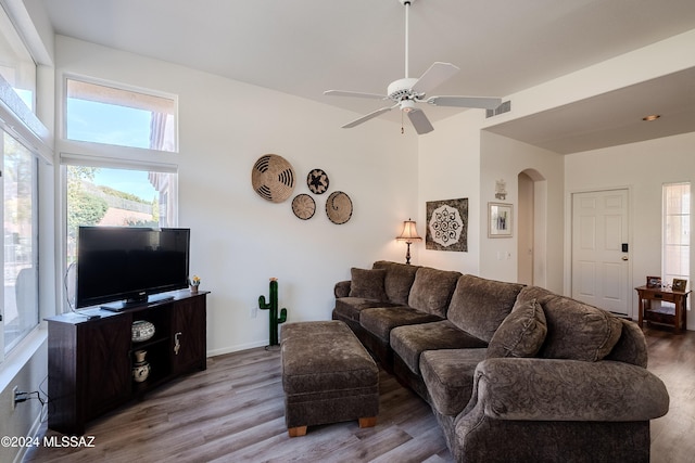 living room with ceiling fan and hardwood / wood-style flooring