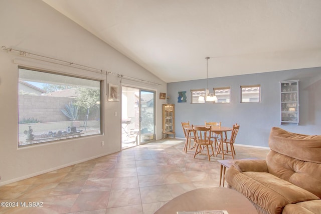 dining area featuring a chandelier and lofted ceiling