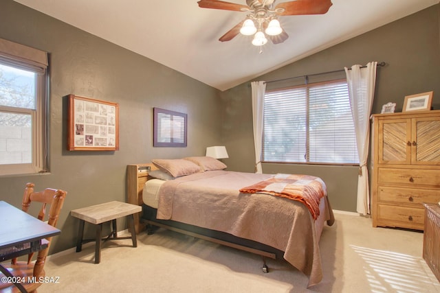 bedroom featuring ceiling fan, light carpet, and lofted ceiling