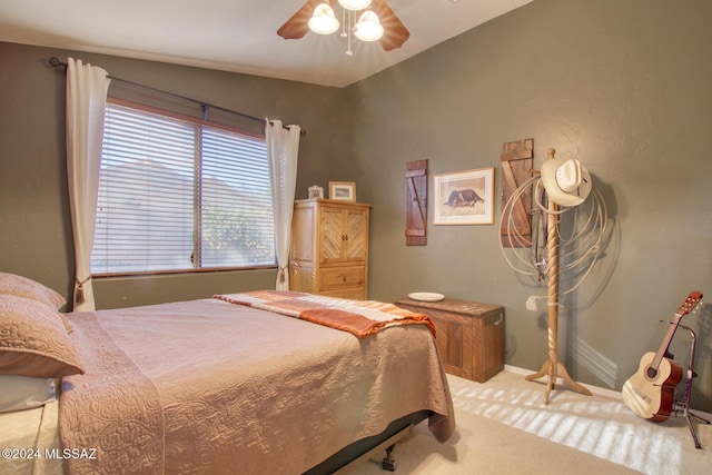 bedroom featuring ceiling fan and light colored carpet