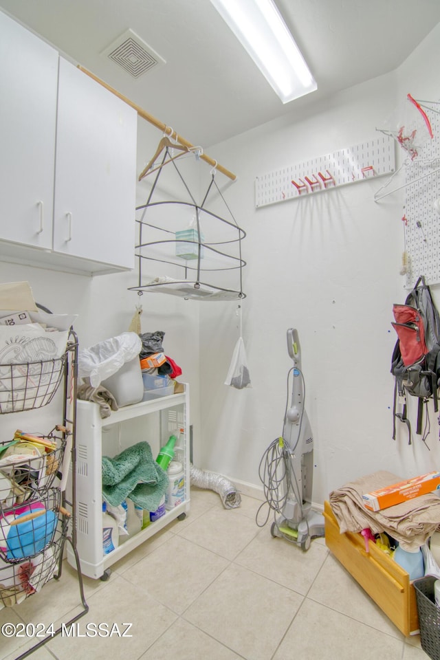 laundry room with light tile patterned floors