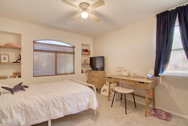 bedroom with ceiling fan and light colored carpet