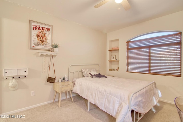 bedroom featuring ceiling fan and light colored carpet