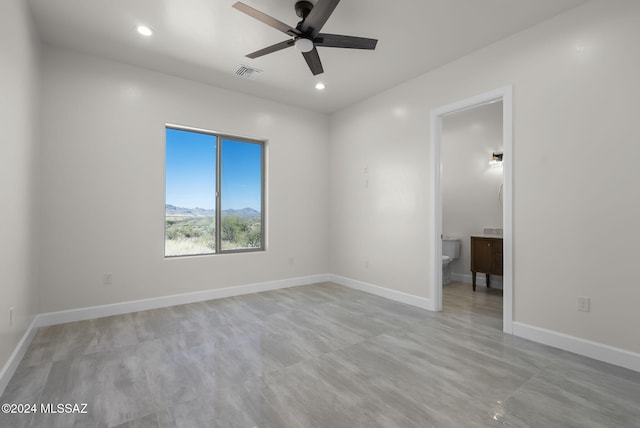 empty room featuring ceiling fan