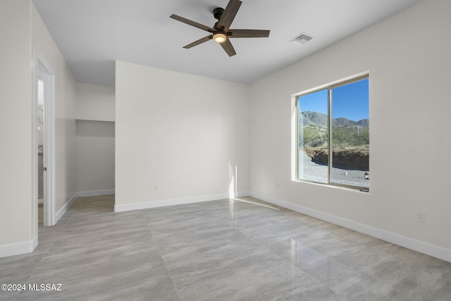 spare room featuring ceiling fan