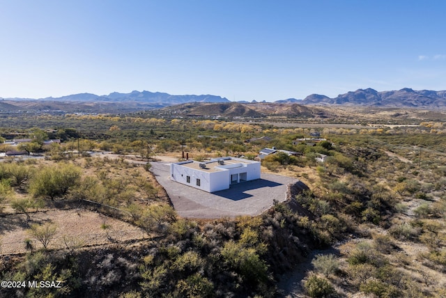 birds eye view of property with a mountain view