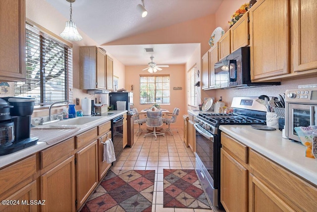 kitchen with ceiling fan, sink, black appliances, pendant lighting, and light tile patterned floors