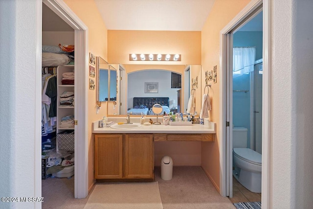 bathroom featuring tile patterned flooring, vanity, and toilet