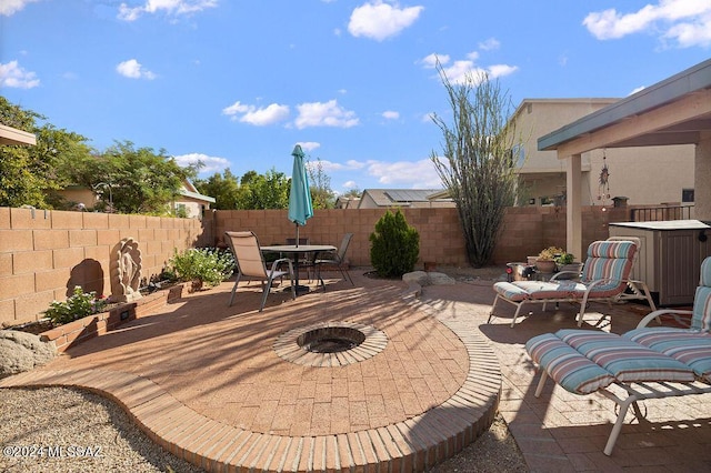 view of patio / terrace with a fire pit