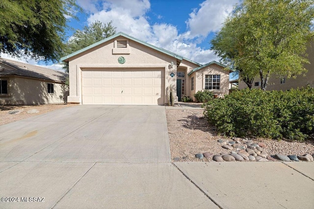 single story home with a garage