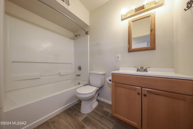 full bathroom with hardwood / wood-style floors, vanity, toilet, and shower / bath combination