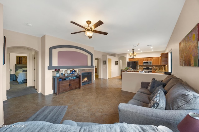 tiled living room featuring ceiling fan