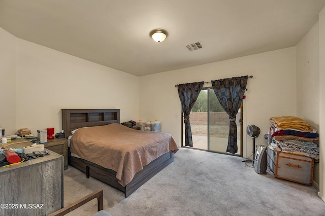 carpeted bedroom featuring access to outside