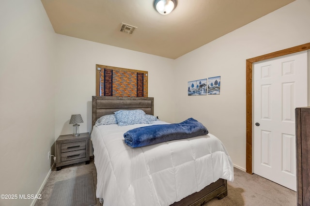 bedroom with light colored carpet