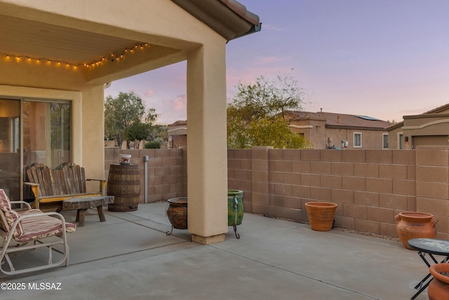 patio terrace at dusk with a fire pit