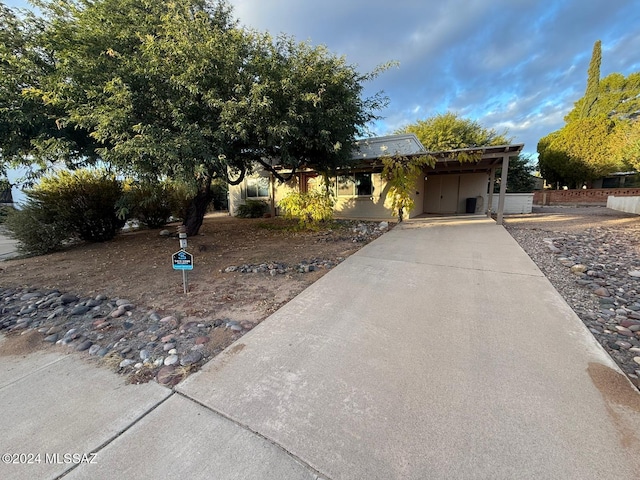 view of front of property featuring a carport