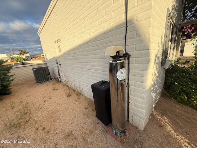 view of side of home featuring cooling unit