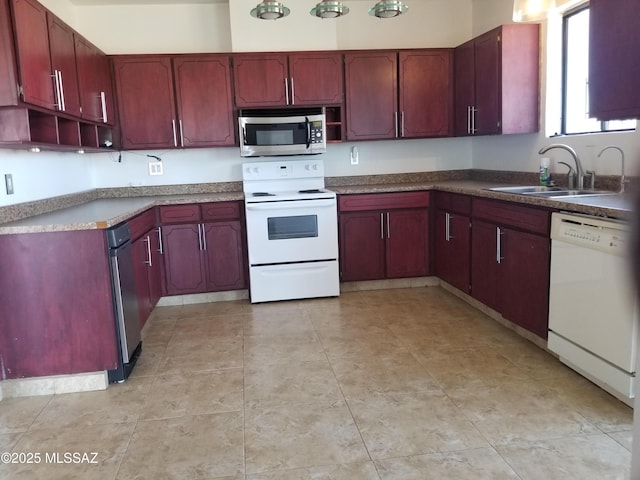 722 N Holm Cir, Nogales, AZ 85621 - kitchen featuring reddish brown cabinets, light tile patterned floors, open shelves, a sink, and white appliances