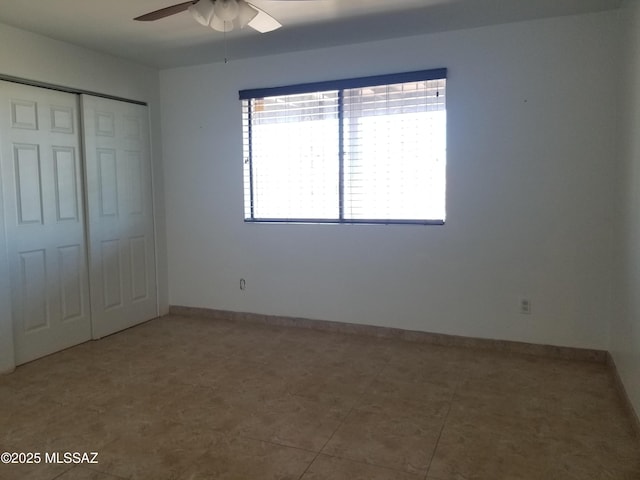722 N Holm Cir, Nogales, AZ 85621 - unfurnished bedroom with a closet, ceiling fan, and baseboards
