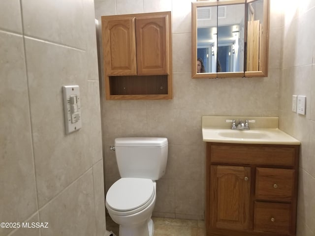 722 N Holm Cir, Nogales, AZ 85621 - bathroom featuring toilet, vanity, and tile walls