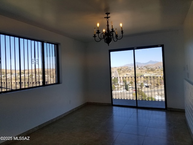 722 N Holm Cir, Nogales, AZ 85621 - tiled empty room with an inviting chandelier, baseboards, and a mountain view