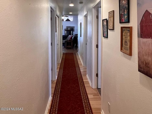 hallway featuring hardwood / wood-style floors