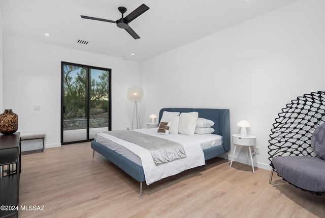 bedroom with ceiling fan, light hardwood / wood-style floors, and access to outside