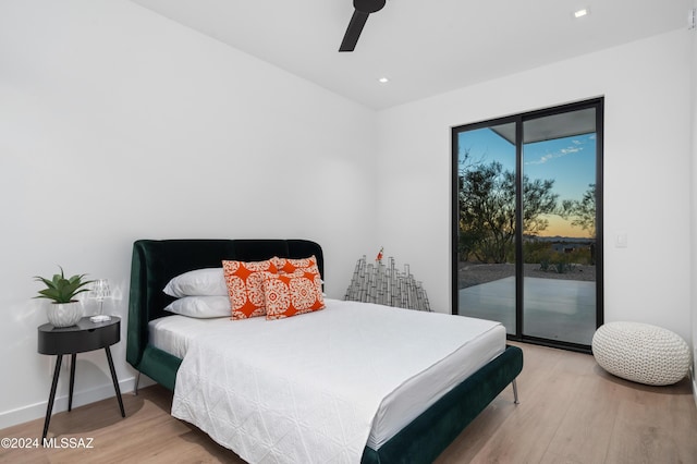 bedroom with ceiling fan, wood-type flooring, and access to exterior