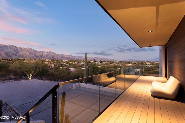 balcony at dusk with a mountain view