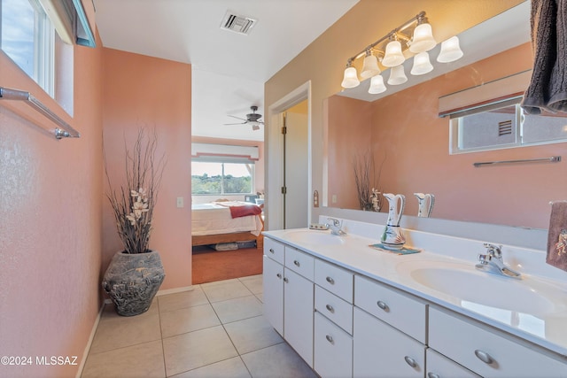 bathroom featuring tile patterned floors, ceiling fan, and vanity