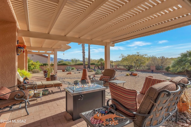 view of patio / terrace with a pergola and an outdoor fire pit