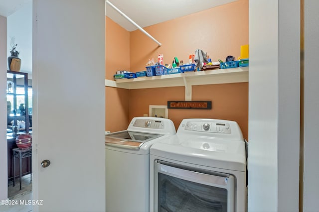 laundry area with independent washer and dryer