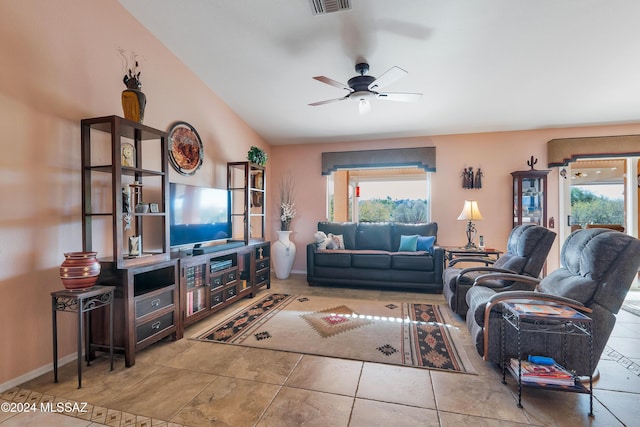 living room featuring tile patterned flooring, ceiling fan, and a healthy amount of sunlight