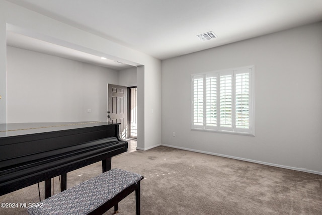 miscellaneous room featuring carpet