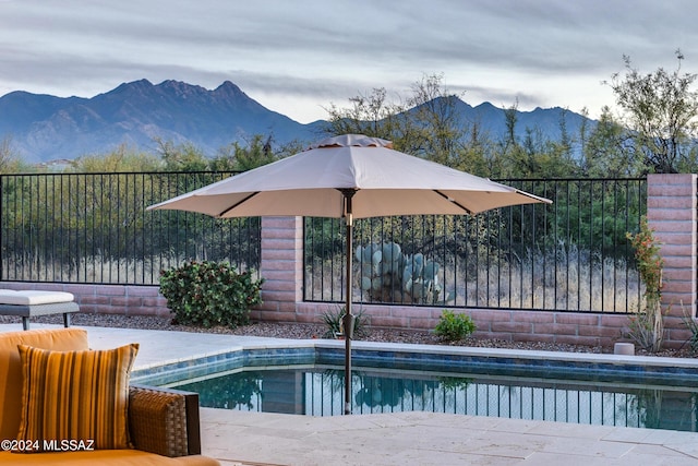 view of swimming pool featuring a mountain view