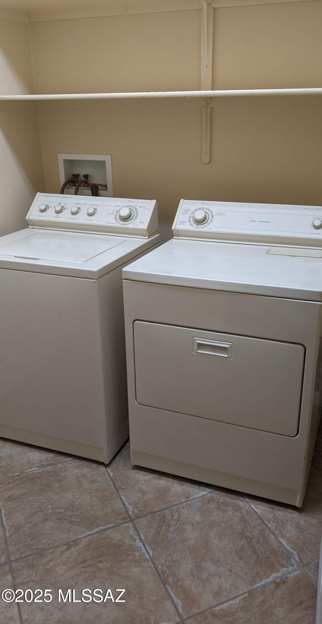 laundry area with washing machine and clothes dryer