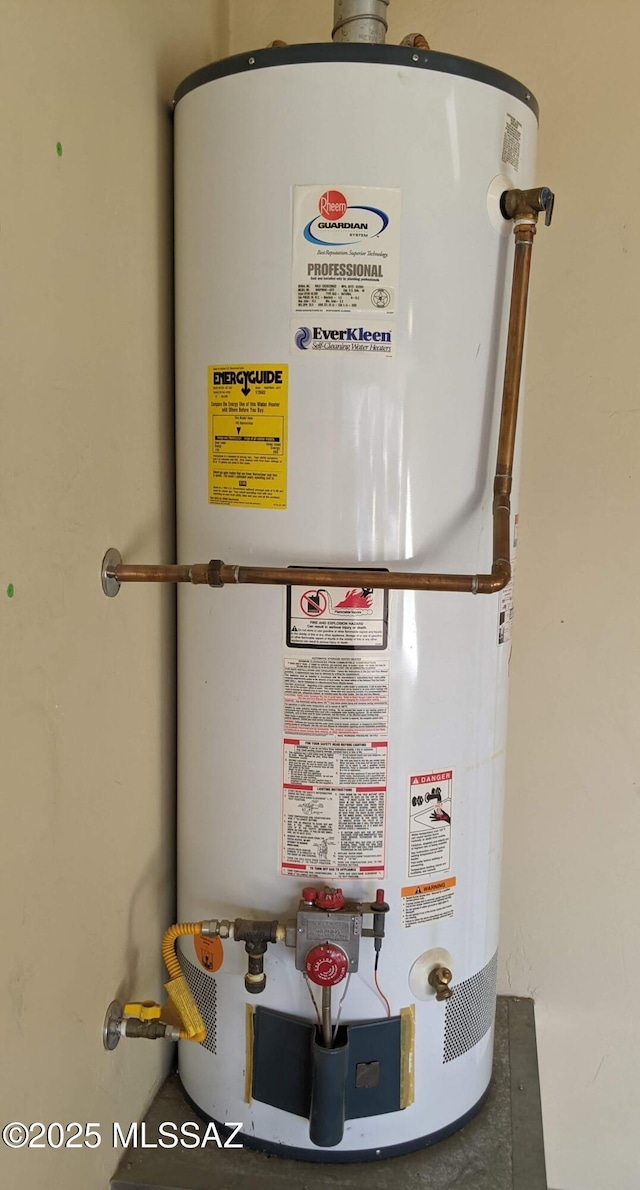 utility room featuring water heater