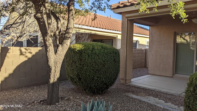 view of home's exterior with a patio area