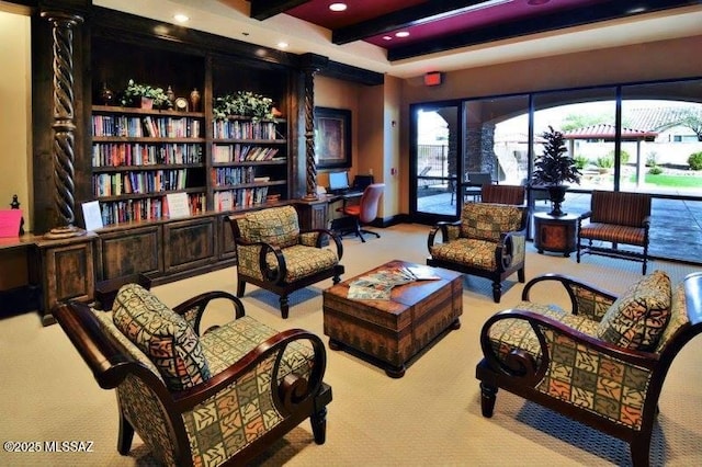 sitting room featuring light colored carpet