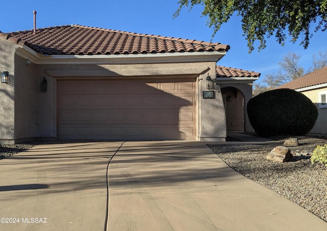 view of front of home with a garage