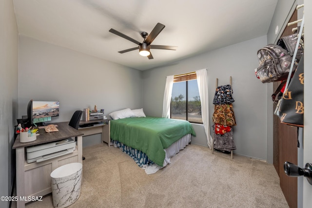 carpeted bedroom featuring a ceiling fan