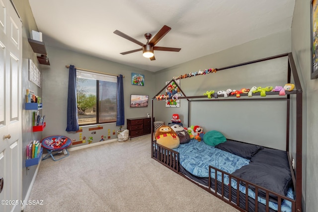 bedroom featuring ceiling fan, baseboards, and carpet