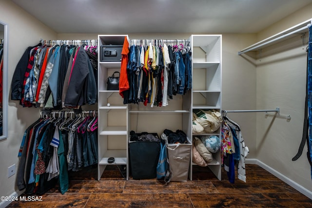 walk in closet featuring dark hardwood / wood-style flooring