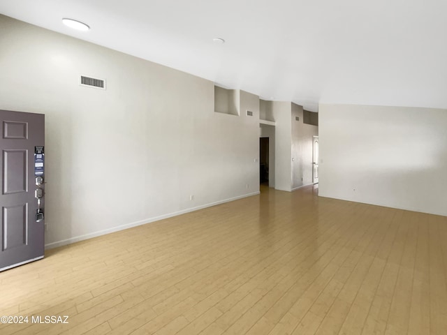 unfurnished room with light hardwood / wood-style floors